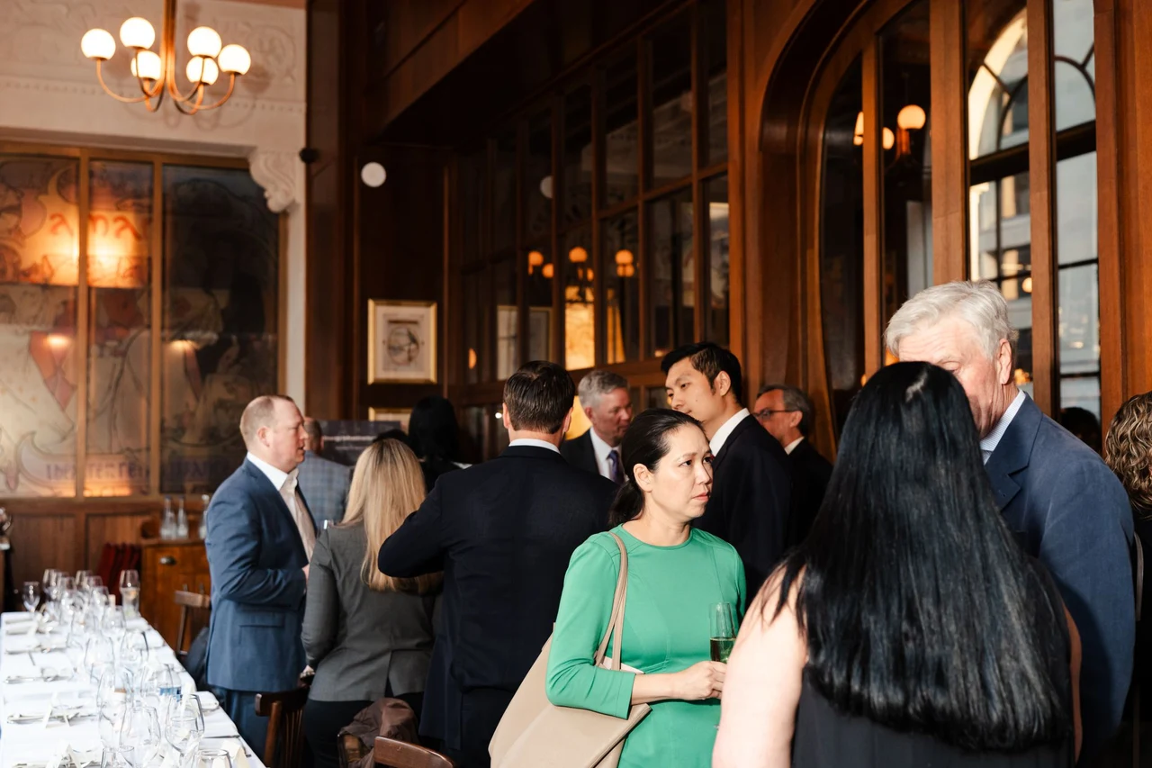 PowerStack guests connecting beside the dinner table at the Washington, DC salon