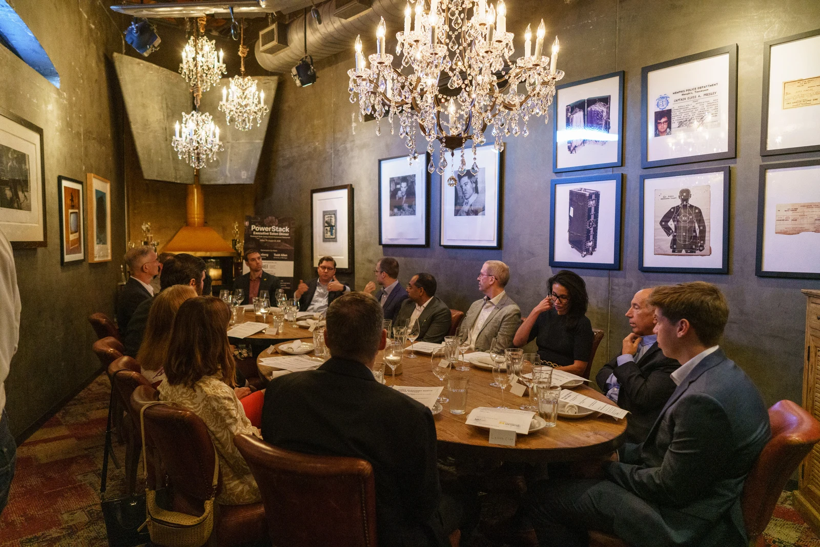 PowerStack guests in conversation around the dinner table at the Dallas executive salon