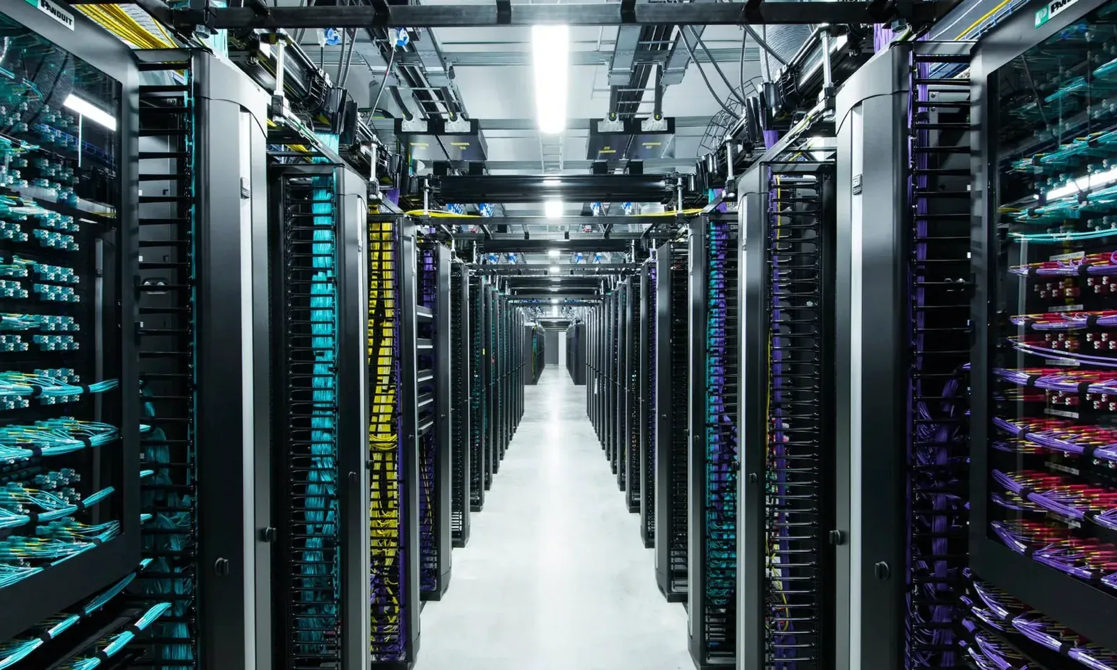 Rows of server racks inside a data center
